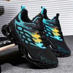 Hot OUKU Men's Blue Athletic Sneakers with Unique Hollow Sole Design, Breathable Knit Upper, and Flame Detail – Lightweight Running Shoes with Orange Accents