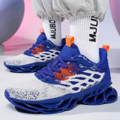 Hot OUKU Men's Blue Athletic Sneakers with Unique Hollow Sole Design, Breathable Knit Upper, and Flame Detail – Lightweight Running Shoes with Orange Accents